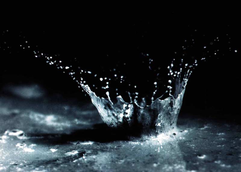 Splash pattern created by a droplet of water hitting a surface.