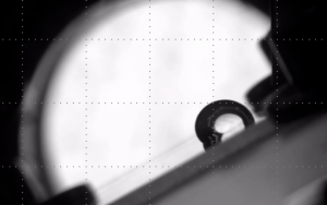 Photo of a droplet on an inclined surface. Contact line friction must be overcome for the drop to move.